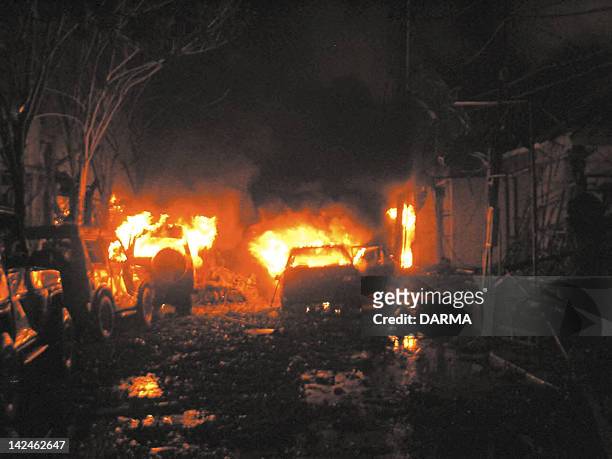 Buildings and cars are on fire after a bomb blast in tourist site of Kuta, Bali 13 October 2002. At least 53 people including 10 foreigners, were...