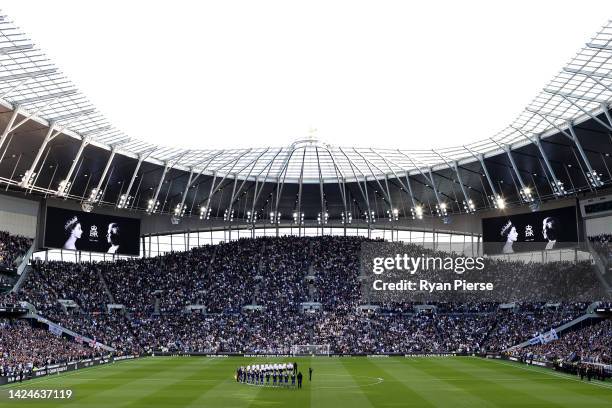 Players and spectators observe a minute silence, as LED boards around the stadium pay tribute to Her Majesty Queen Elizabeth II, who died away at...