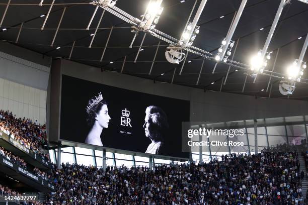 General view as an LED board inside the stadium displays a tribute to Her Majesty Queen Elizabeth II, who died away at Balmoral Castle on September...