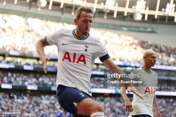 Harry Kane of Tottenham Hotspur celebrates after scoring their team's first goal during the Premier League match between Tottenham Hotspur and...