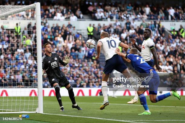 Harry Kane of Tottenham Hotspur scores their team's first goal during the Premier League match between Tottenham Hotspur and Leicester City at...