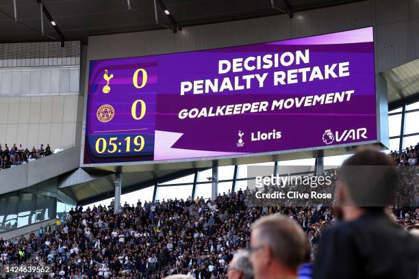 The LED board shows the decision by VAR for the Leicester City penalty to be retaken during the Premier League match between Tottenham Hotspur and...