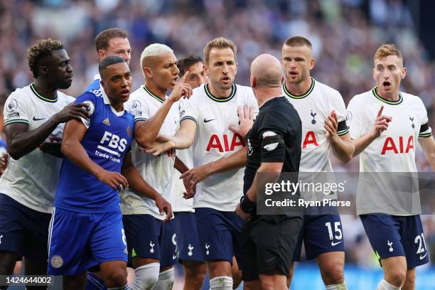 Harry Kane of Tottenham Hotspur argues with teammates to Referee Simon Hooper after Davinson Sanchez of Tottenham Hotspur goal was disallowed during...