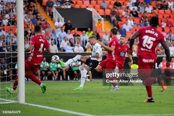 Samu Castillejo of Valencia CF scores their team's first goal during the LaLiga Santander match between Valencia CF and RC Celta at Estadio Mestalla...