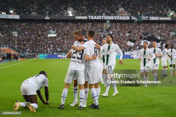 Jonas Hofmann of Borussia Monchengladbach celebrates with teammates after scoring their team's second goal goal during the Bundesliga match between...
