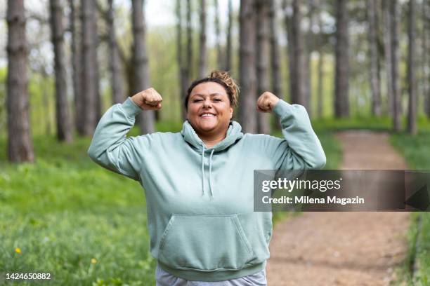 proud plus size woman on her weight loss journey - fat loss training stock pictures, royalty-free photos & images