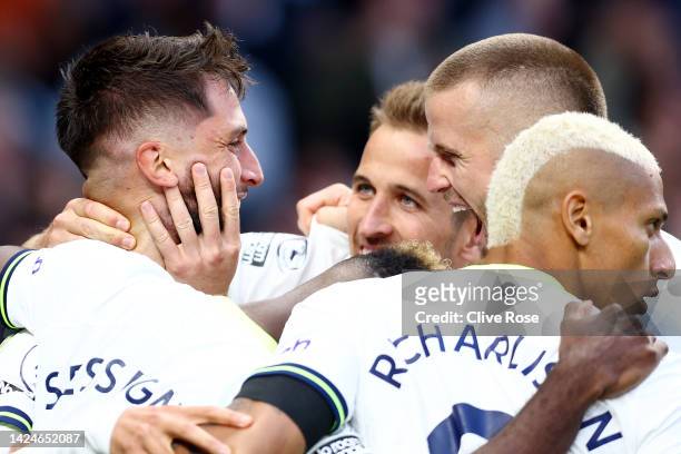 Rodrigo Bentancur of Tottenham Hotspur celebrates with Eric Dier and teammates after scoring their team's third goal during the Premier League match...
