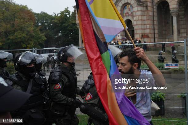 Participant at EuroPride is asked by riot police to continue marching during the Pride Parade, on September 17, 2022 in Belgrade, Serbia. The Serbian...