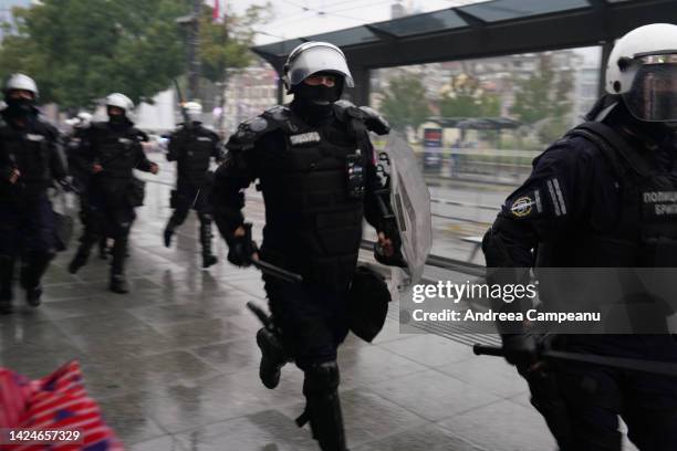 Riot police run towards anti-pride protesters during EuroPride, on September 17, 2022 in Belgrade, Serbia. The Serbian prime minister gave the...