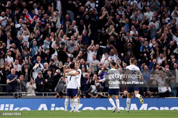 Son Heung-Min of Tottenham Hotspur celebrates with teammate Harry Kane after scoring their team's fourth goal during the Premier League match between...