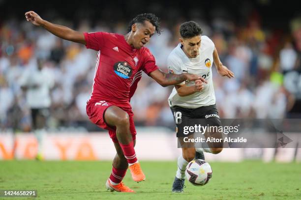 Andre Almeida of Valencia CF battles for possession with Renato Tapia of RC Celta during the LaLiga Santander match between Valencia CF and RC Celta...