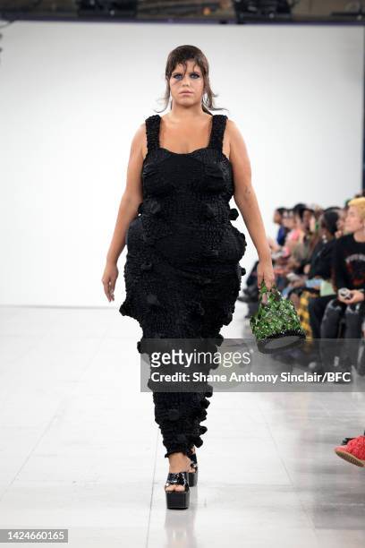 Model walks the runway at the Feben show during London Fashion Week September 2022 at the BFC NEWGEN Show Space on September 17, 2022 in London,...