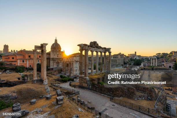 the roman forum at sunrise, rome, italy - foro romano foto e immagini stock