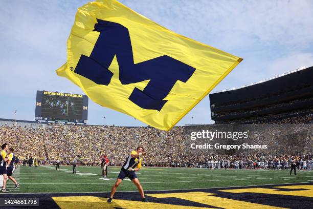 Michigan Wolverines cheerleader celebrates a first half touchdown while playing the Connecticut Huskies at Michigan Stadium on September 17, 2022 in...