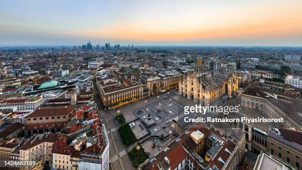 aerial drone piazza del duomo, cathedral square, with milan cathedral or duomo di milano during morning blue hour, milan, lombardia, italy - milan landscape stock pictures, royalty-free photos & images