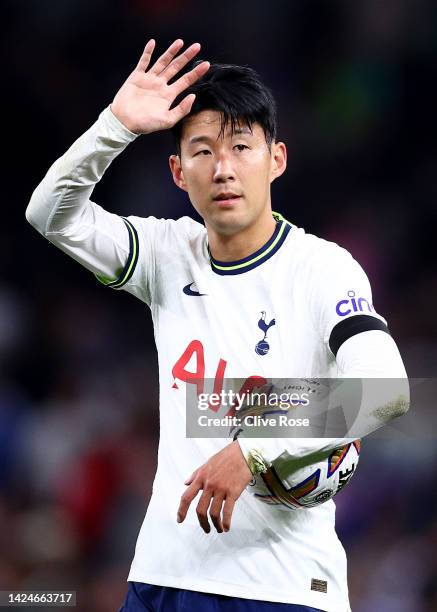 Son Heung-Min of Tottenham Hotspur celebrates victory with their hat-trick match ball after the Premier League match between Tottenham Hotspur and...