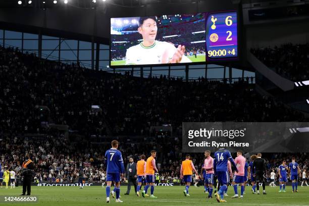 Players of Leicester City walk off the pitch as the LED board shows the final score following the Premier League match between Tottenham Hotspur and...