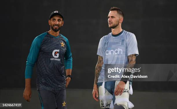 Shan Masood of Pakistan speaks to Alex Hales of England during a England Nets Session at the The National Stadium on September 17, 2022 in Karachi,...