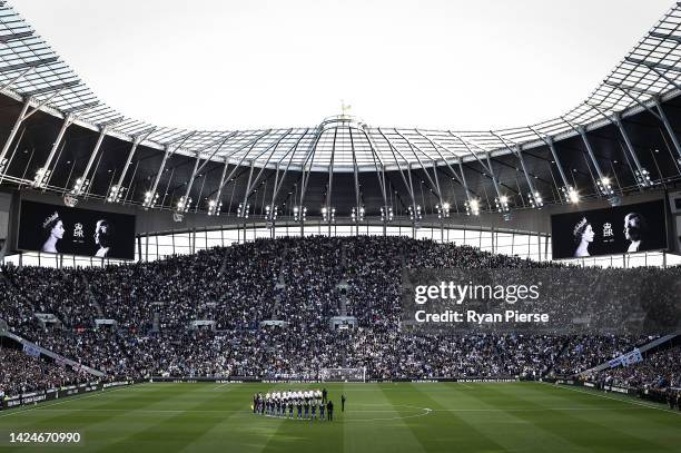 Players and spectators observe a minute silence, as LED boards around the stadium pay tribute to Her Majesty Queen Elizabeth II, who died away at...