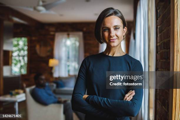 copy space shot of charming woman looking at camera and smiling with confidence - blue eyes man stock pictures, royalty-free photos & images