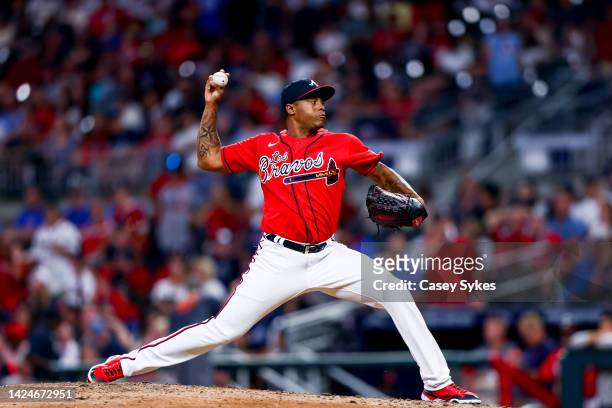 Raisel Iglesias of the Atlanta Braves delivers a pitch in the top of the ninth inning of a game against the Philadelphia Phillies at Truist Park on...