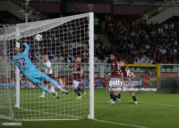 Vanja Milinkovic-Savic of Torino FC saves the ball on the goal line to deny Davide Frattesi of US Sassuolo an opening goal during the Serie A match...