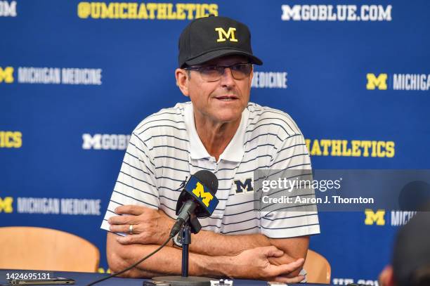 Head Football Coach Jim Harbaugh of the Michigan Wolverines speaks to the media after a college football game against the Connecticut Huskies at...