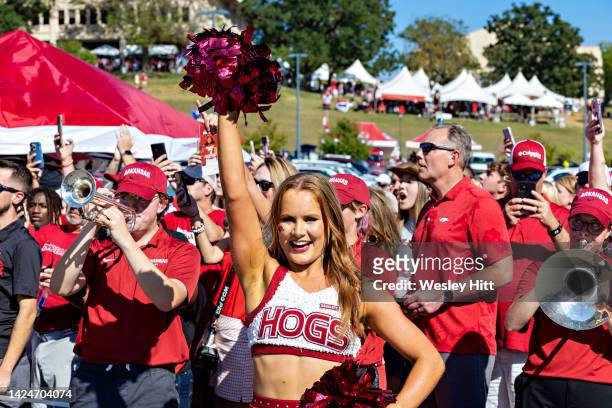 Pom Squad member of the Arkansas Razorbacks cheers on the team during the walk to the stadium before a game against the Missouri State Bears at...