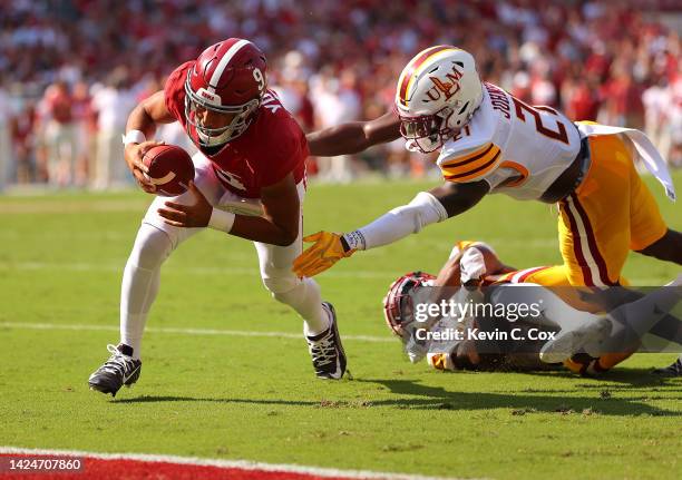 Bryce Young of the Alabama Crimson Tide rushes for a touchdown away from Jabari Johnson of the Louisiana Monroe Warhawks during the first quarter at...