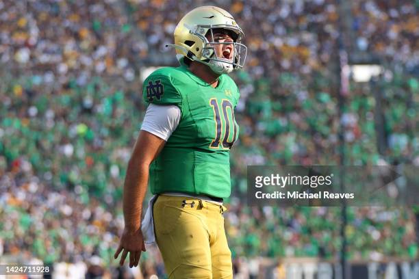 Drew Pyne of the Notre Dame Fighting Irish celebrates after throwing a touchdown pass to Michael Mayer against the California Golden Bears during the...