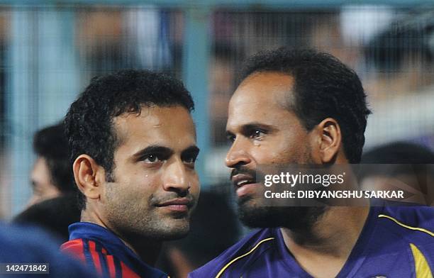 Kolkata Knight Riders batsman Yusuf Pathan shares a light a moment with Delhi Daredevils player and his brother Irfan Pathan as the IPL Twenty20...