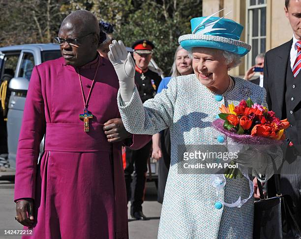 Queen Elizabeth II waves to the crowd alongside the Archbishop of York, Dr John Sentamu , during a visit to the Yorkshire Museum after the Royal...