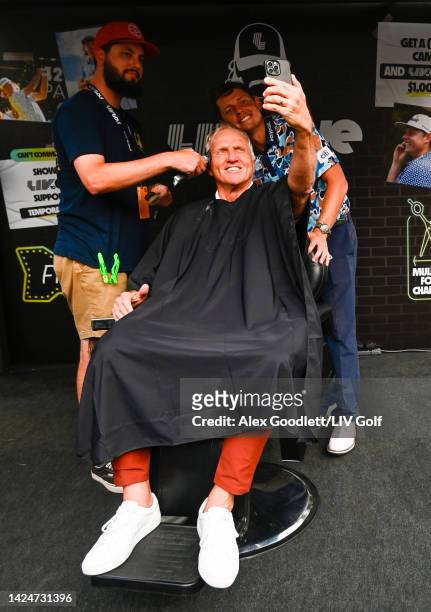 Greg Norman, CEO and commissioner of LIV Golf, and Team Captain Cameron Smith of Punch GC are seen at the LIV Gives mullet haircut booth during Day...