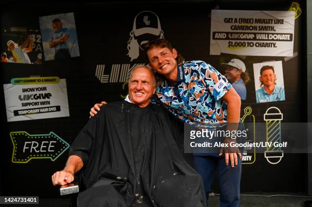 Greg Norman, CEO and commissioner of LIV Golf, and Team Captain Cameron Smith of Punch GC are seen at the LIV Gives mullet haircut booth during Day...