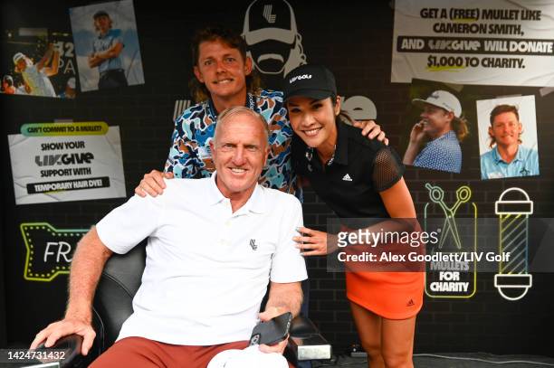 Greg Norman, CEO and commissioner of LIV Golf, Team Captain Cameron Smith of Punch GC, and Su-Ann Heng are seen at the LIV Gives mullet haircut booth...