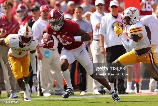 Traeshon Holden of the Alabama Crimson Tide pulls in this reception against Deuce Mayberry of the Louisiana Monroe Warhawks as he turns and rushes...