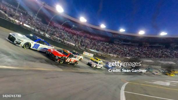 Aric Almirola, driver of the Ford BlueOval City Ford, and Chase Briscoe, driver of the Magical Vacation Planner Ford, lead the field on a pace lap...