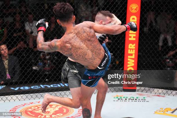 Andre Fili kicks the head of Bill Algeo in a featherweight fight during the UFC Fight Night event at UFC APEX on September 17, 2022 in Las Vegas,...