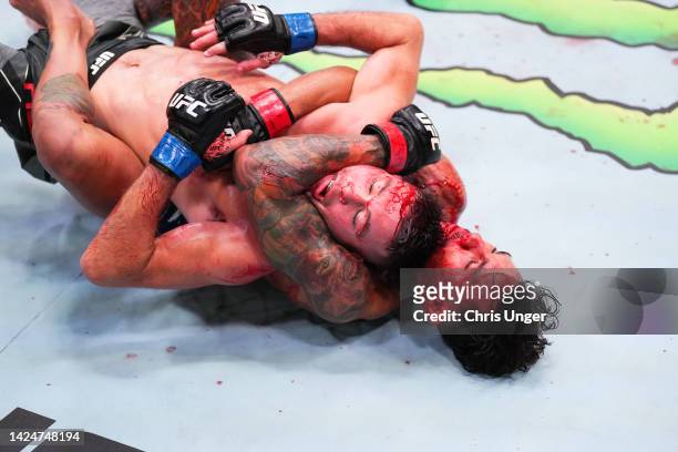 Andre Fili attempts to submit Bill Algeo in a featherweight fight during the UFC Fight Night event at UFC APEX on September 17, 2022 in Las Vegas,...