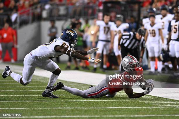 Jaxon Smith-Njigba of the Ohio State Buckeyes makes a diving catch during the second quarter of a game against the Toledo Rockets at Ohio Stadium on...