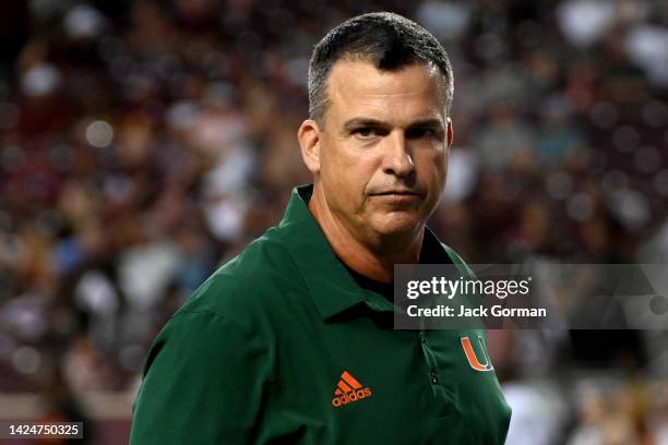 Head coach Mario Cristobal of the Miami Hurricanes looks on during warm ups prior to the game against the Texas A&M Aggies at Kyle Field on September...