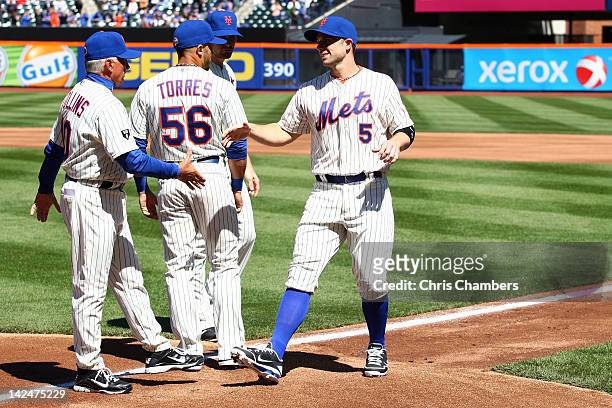 David Wright of the New York Mets greets manager Terry Collins during player introductions against the Atlanta Braves during their Opening Day Game...