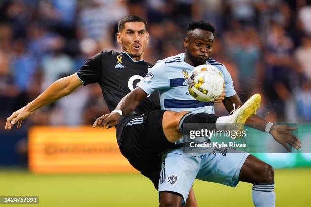 Michael Boxall of Minnesota United attempts to deflect a pass away from William Agada of Sporting Kansas City during the first half at Children's...