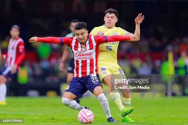 Fernando Beltran of Chivas fights for the ball with Richard Sanchez of America during the 15th round match between America and Chivas as part of the...