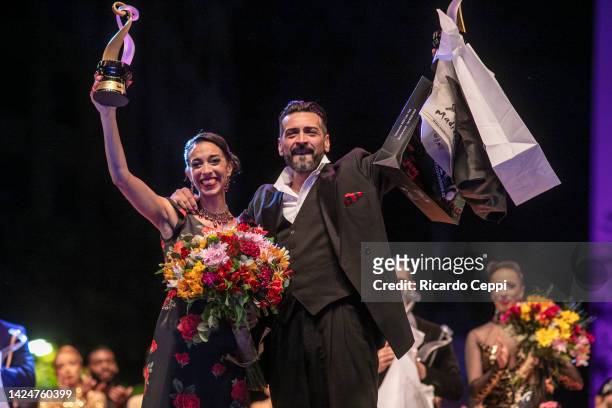 Couple Ricardo Astrada and Constanza Vieyto, from Pergamino, Buenos Aires celebrates after winning first place on the Tango Stage during the final...