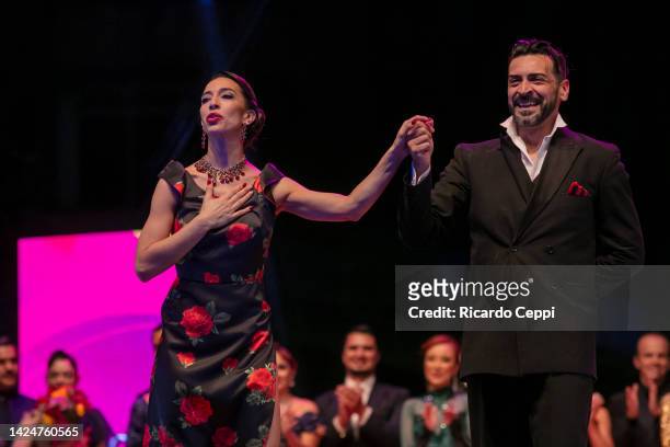 Couple Ricardo Astrada and Constanza Vieyto, from Pergamino, Buenos Aires celebrates after winning first place on the Tango Stage during the final...