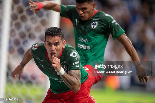 Sebastián Vegas of Monterrey celebrates with teammates after scoring his team's first goal during the 15th round match between Monterrey and Atlas as...