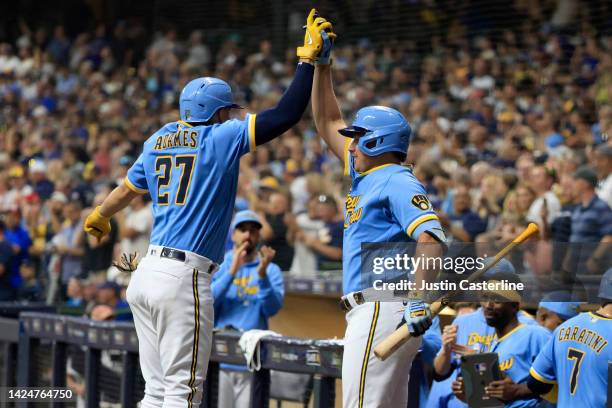 Willy Adames of the Milwaukee Brewers celebrates a three run home with Luis Urias of the Milwaukee Brewers during the third inning in the game...