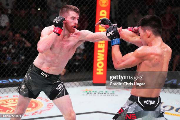 Cory Sandhagen punches Song Yadong of China in a bantamweight fight during the UFC Fight Night event at UFC APEX on September 17, 2022 in Las Vegas,...