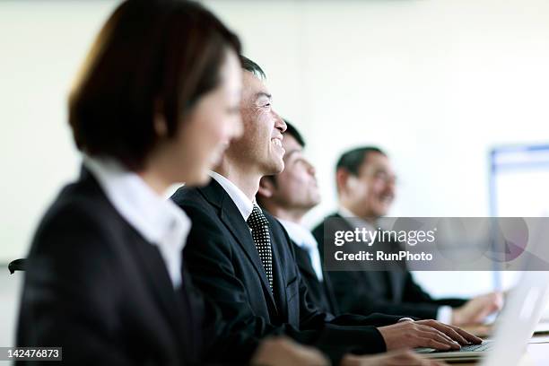 business people having meeting in the office - meeting candid office suit stockfoto's en -beelden